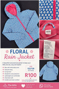 Kids blue and white daisy print rain jacket with bright pink lining, hood and full front zip, size 122/128